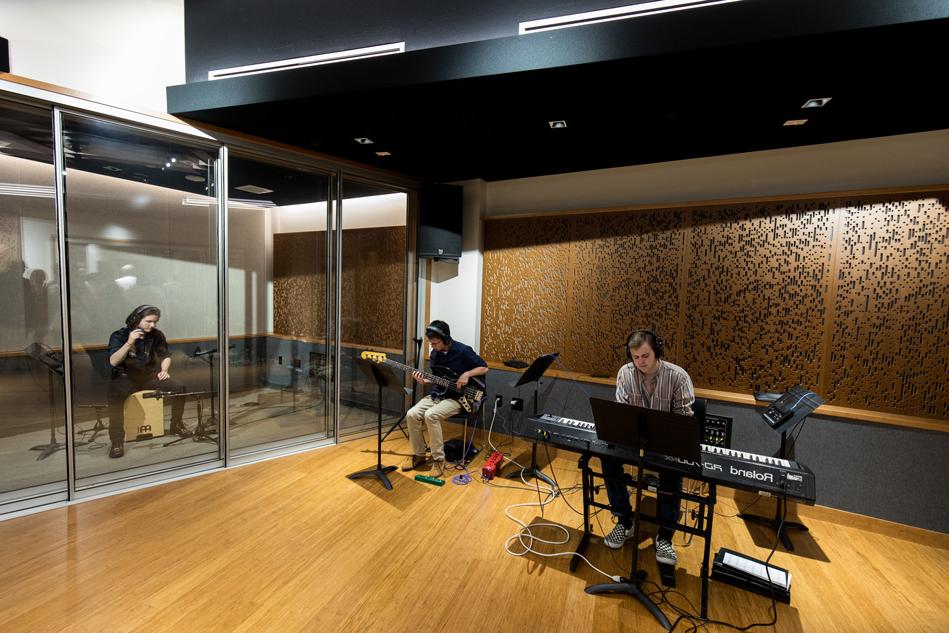 Students practicing and using the new recording studio in the BMC